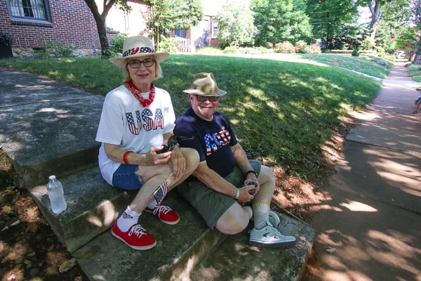 Jann and Bob Knowles wait in a shaded spot for the parade to begin. Photo by Travis Hudgons