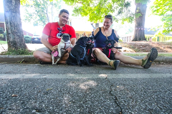 Robbie and Erica Sammons and their pugs Sofie, Maggie, Sammie and Remmie. Photo by Travis Hudgons