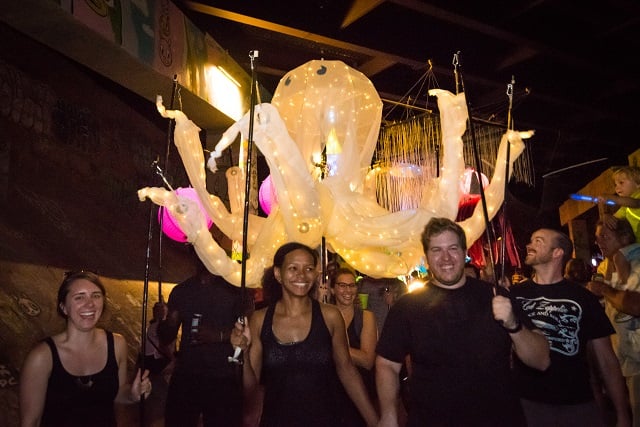 Participants in the Lantern Parade carry an octopus lantern along the BeltLine.