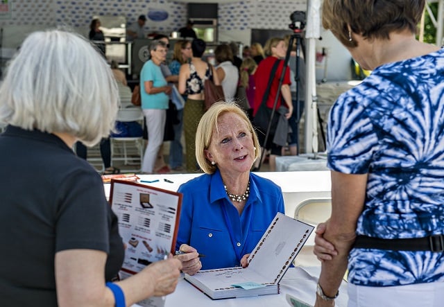 Author Anne Byrn talks to fans as she autographs books during the Decatur Book Festival on Saturday. Photo: Jonathan Phillips