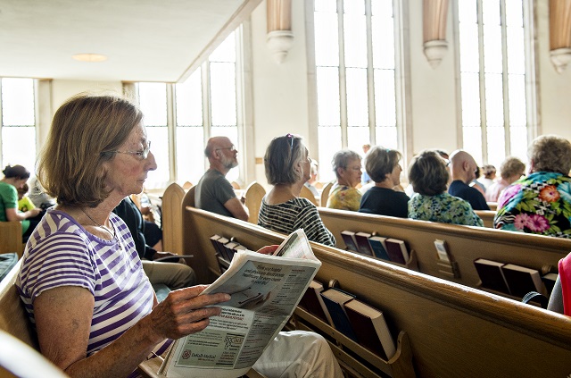 Wendy Bandrowski looks at the schedule for the Decatur Book Festival as she decides which author to see next on Saturday. Photo: Jonathan Phillips