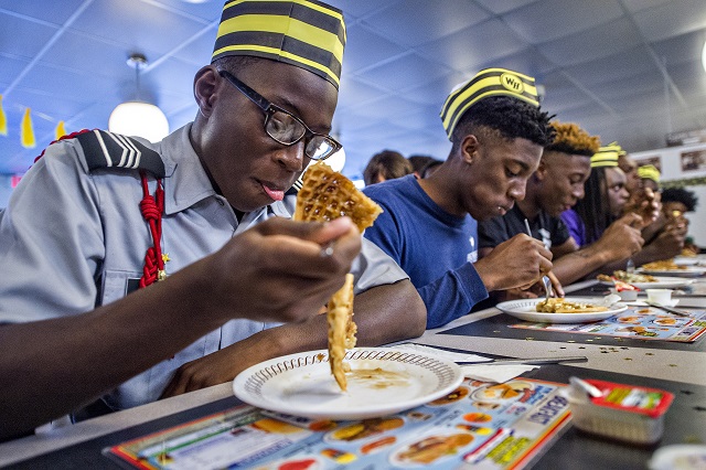 Martize Smith (left) takes the slow and steady approach to the waffle eating contest at the Waffle House off of Decatur Square on Friday. Photo: Jonathan Phillips