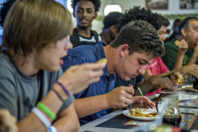 Sam Cooper opts for the fork approach during the waffle eating contest at the Waffle House off of Decatur Square on Friday. Photo: Jonathan Phillips
