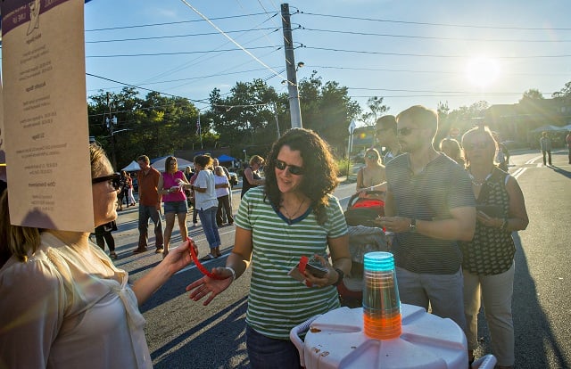 Melia Foley (center) gets her tickets as she enters the Kirkwood Wine Stroll on Friday. Photo: Jonathan Phillips