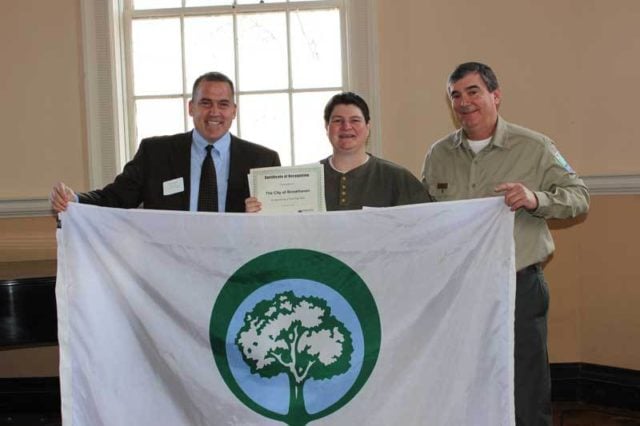Brookhaven City Arborist Kay Evanovich, center, receives Tree City USA Community recognition from Arbor Day Foundation President, Dan Lambe, left, and Georgia Forestry Commission Director, Robert Farris, right. Photo provided by the Brookhaven Post.