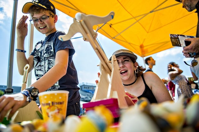Aisling McHenry-Stelle (right) and Otto Hillegass use catapults during the Atlanta Maker Faire in Decatur on Saturday. Photo: Jonathan Phillips