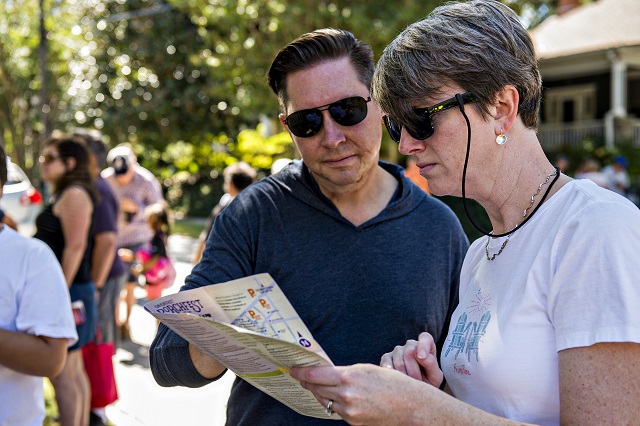 Leigh Layton (right) and her husband Todd check out the map during the annual Oakhurst Porchfest on Saturday. Photo: Jonathan Phillips