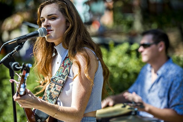 Sydney Rhame performs off of Mead Rd. during the annual Oakhurst Porchfest on Saturday. Photo: Jonathan Phillips