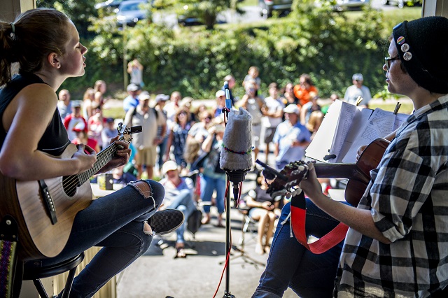 The 3 Percent's Kate Joy (left) and Ryan Murphy perform off of Mead Rd. during the annual Oakhurst Porchfest on Saturday. Photo: Jonathan Phillips