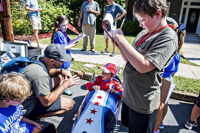 William Roach (right) writes down his remarks as he judges Anthony Amelio's car before the start of the 6th annual Madison Ave. Soapbox Derby in Oakhurst on Saturday. Photo: Jonathan Phillips