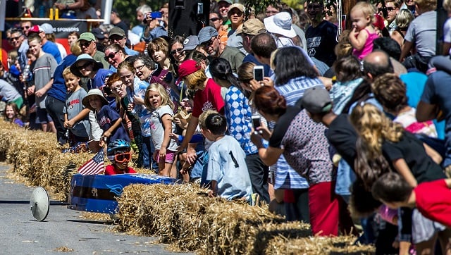 Sai Kakarala crashes during the 6th annual Madison Ave. Soapbox Derby in Oakhurst on Saturday. Photo: Jonathan Phillips