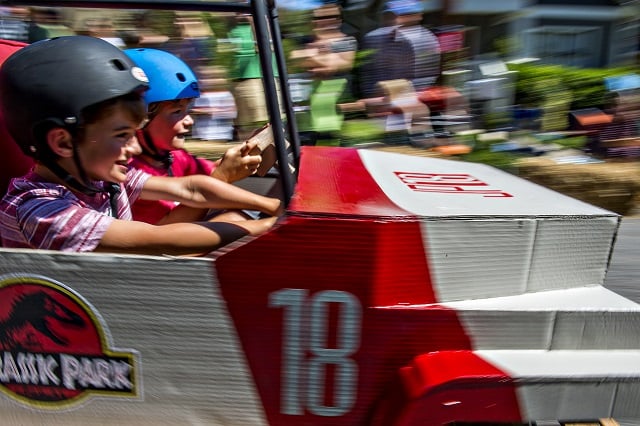 Will Zygmont and is brother Maxwell race down the street in a Jurassic Park jeep during the 6th annual Madison Ave. Soapbox Derby in Oakhurst on Saturday. Photo: Jonathan Phillips