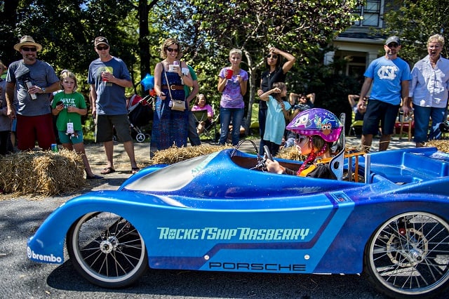 Sloane Rasberry takes off from the starting line as she steers her car down the street during the 6th annual Madison Ave. Soapbox Derby in Oakhurst on Saturday. Photo: Jonathan Phillips
