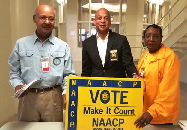 The DeKalb NAACP’s “Voices Beyond Bars” voter registration drive registered 134 inmates at the DeKalb County Jail on October 10th.  (Left to right) Volunteer George Turner, DeKalb County Sheriff Jeffrey L. Mann, and Georgia NAACP Political Action Chair Vivian Moore. (Photo by DeKalb County Sheriff’s Office)