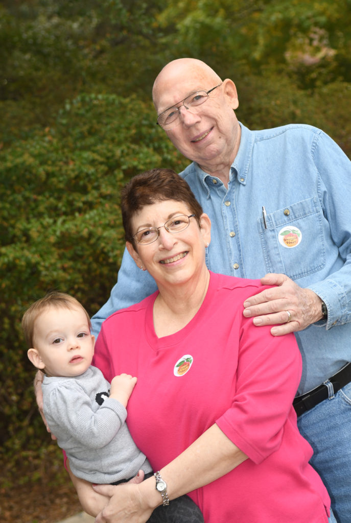 Diane Pomberg and her husband, John Pomberg, brought their granddaughter, Minka Pomberg, 18 months, to vote at the Avondale Estates City Hall on November 8, 2016. Both grandparents voted for Secretary Clinton. Diane Pomberg said, "The lines moved quickly. Everyone was organized and patient." Both grandparents personally met Secretary Clinton.. They said that she is very sincere in her beliefs and is a strong woman.