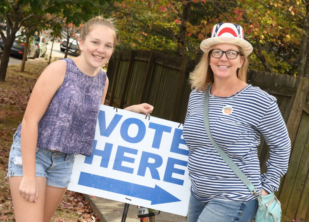 Avery Myers, 13, and her mom, Jill Myers, are at the Oakhurst Baptist Church on November 8, 2016. Jill says, "Hillary all the way. No question."
