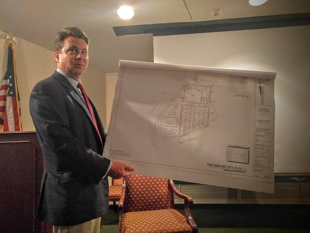 Attorney Den Web shows a site plan during a Nov. 2 meeting at the Decatur Library. Photo by Dan Whisenhunt