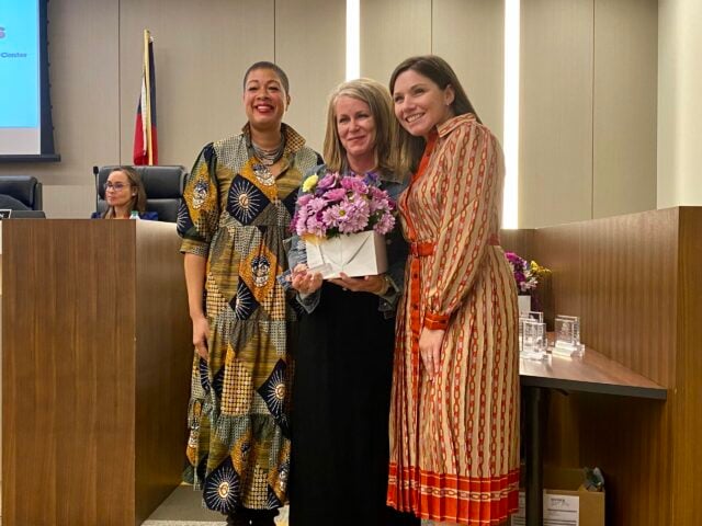 Decatur School Board Chair Jana Johnson-Davis (left) and Superintendent Maggie Fehrman (right) presented Anne Collins (center) with the College Heights Teacher of the Year Award. Photo by Zoe Seiler. 